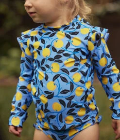 The Girls' Ruffle Rash Guard Tankini Set - Nectarine Orchard -Deals US Tropic Bikini Store 5 ExtraProductShot 1efe85e3 2325 4479 99f8 a7210feaf0fd